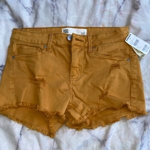 Tilly’s Tan Ripped Jean Shorts